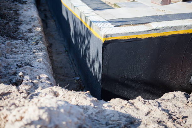 Professional Basement Waterproofing technician working in Concord, AL